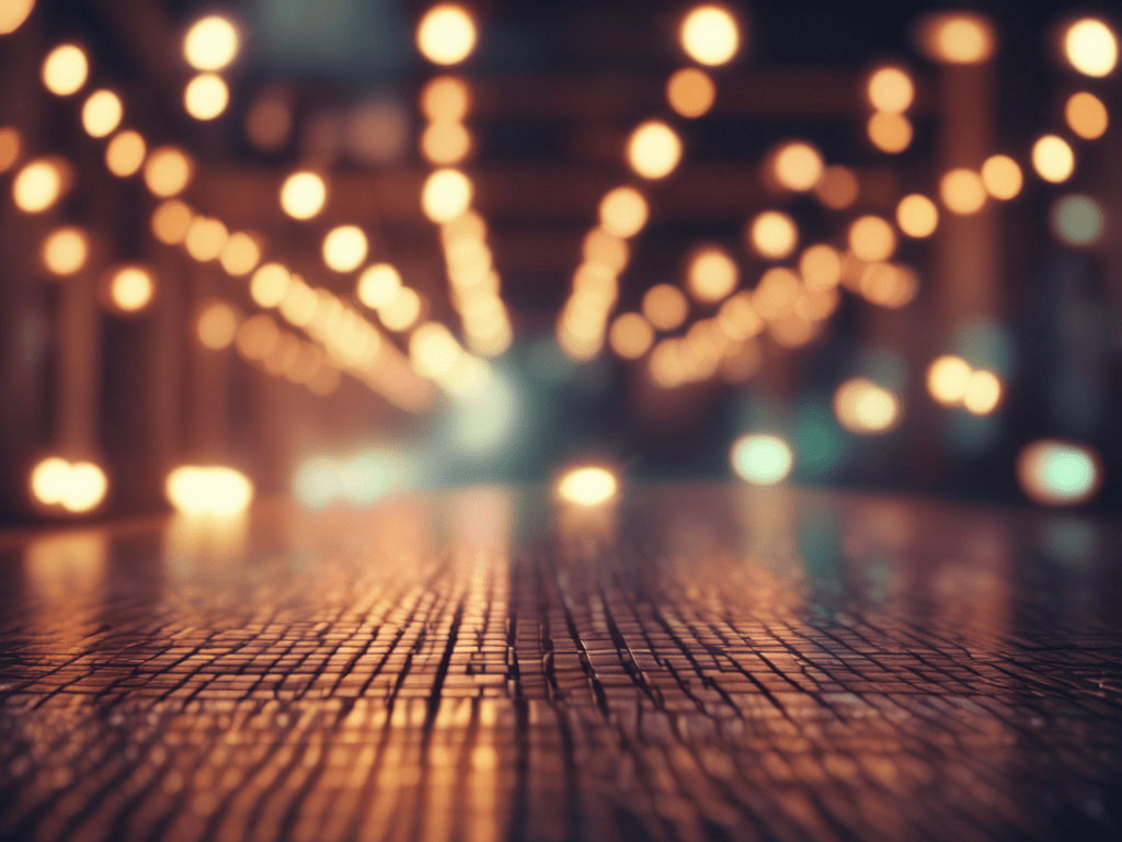 Blurred city street lights at night with a bokeh effect.